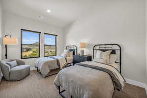 Bedroom with lofted ceiling, wood finished floors, and recessed lighting