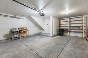 Garage featuring storage shelves