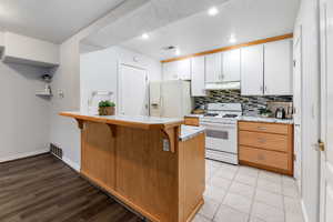 Kitchen featuring white appliances