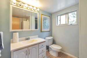 Bathroom featuring vanity and tile patterned flooring