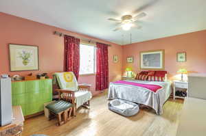 Bedroom with light wood finished floors