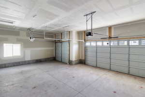 Garage featuring a garage door opener