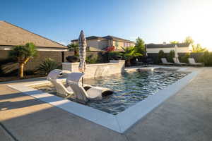 View of pool with a patio area and a fenced backyard