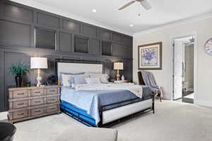 Bedroom with crown molding, light colored carpet, a ceiling fan, recessed lighting, and ensuite bathroom