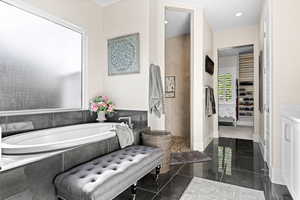 Full bath featuring a bath and walk in shower