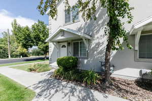 Entrance to property with stucco siding
