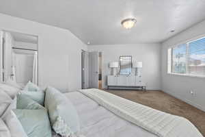 Carpeted bedroom featuring baseboards