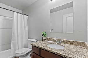 Bathroom featuring vanity and shower / tub combo