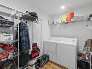 Laundry area featuring washing machine and clothes dryer in the unit