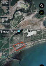 Aerial map of property and surrounding area featuring property boundaries highlighted