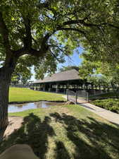 Pergola for the  community with a yard and a water view