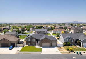 Aerial perspective of suburban area with a mountain backdrop