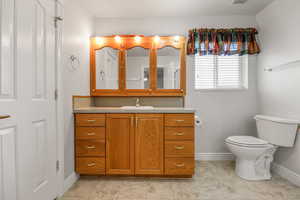 Bathroom featuring vanity and light tile patterned floors