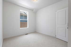 Unfurnished room with carpet flooring