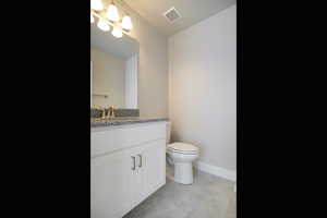 Bathroom with vanity and tile patterned flooring