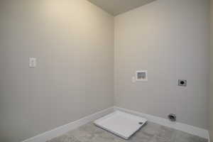 Laundry area with hookup for an electric dryer and hookup for a washing machine