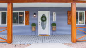 Front of main house with  covered porch and doorbell camera
