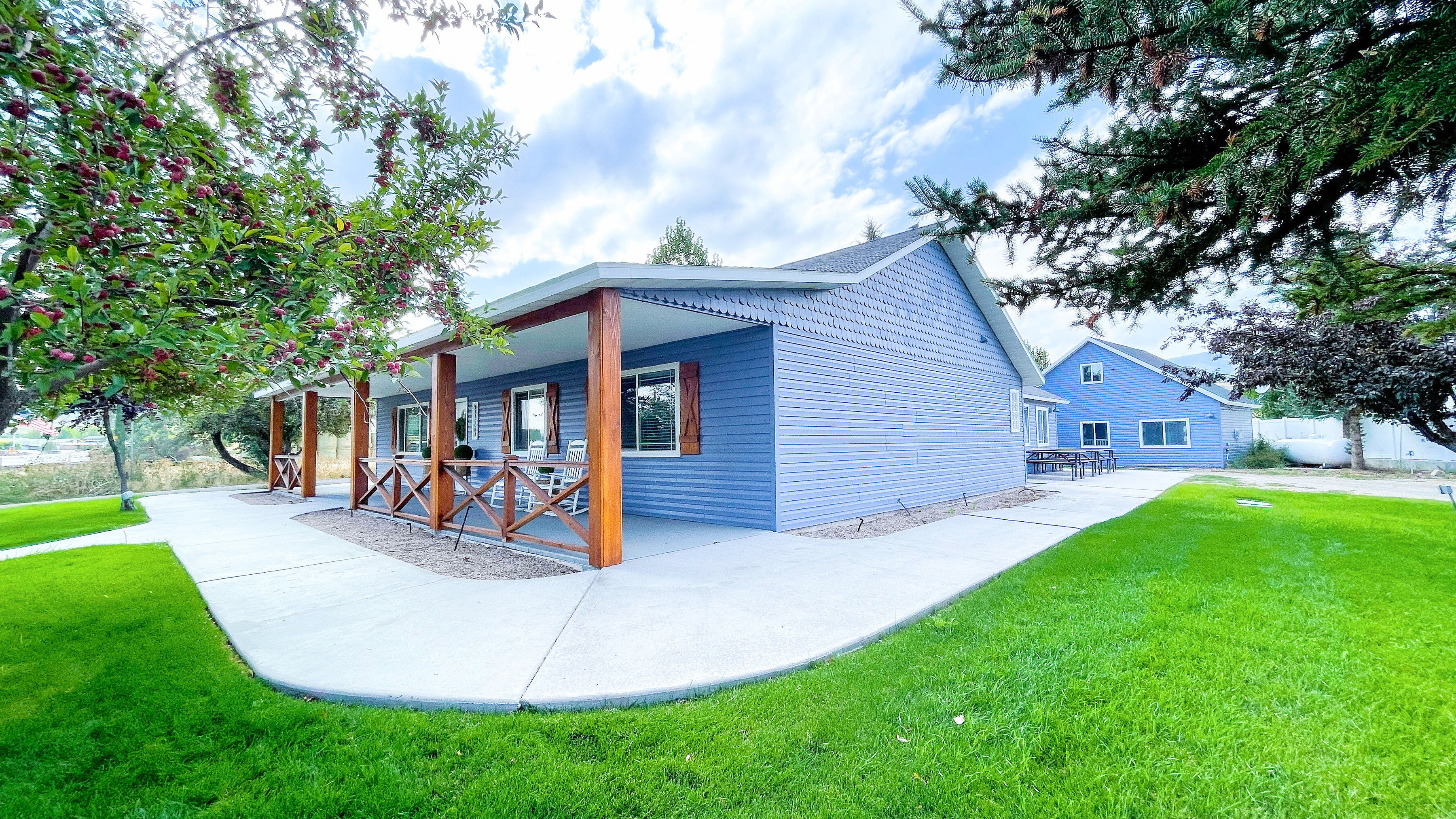 View of side of property with lush, beautiful REAL grass!!