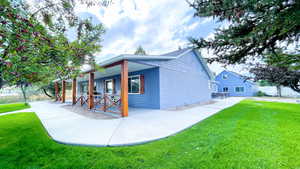 View of side of property with lush, beautiful REAL grass!!