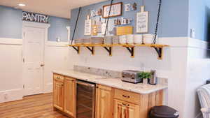 Kitchen featuring a beverage cooler and large walk-in pantry