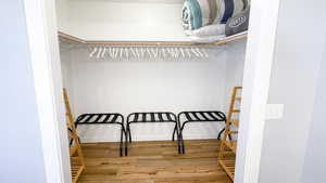 Spacious closet with pack and play crib and bedding for sleeper sofa