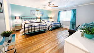 Bedroom with 2 queen size beds and ceiling fan