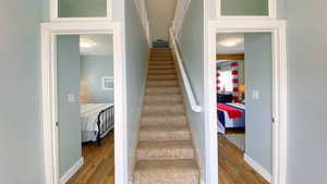 Cottage entryway looking up to the loft and into each bedroom