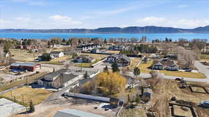 Aerial perspective of suburban area with a water and mountain view