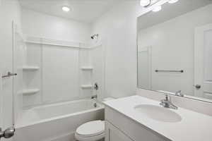 Full bath featuring vanity and shower / bathtub combination