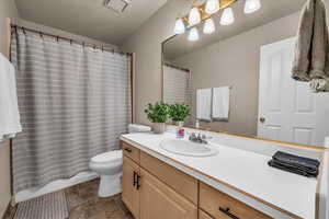 Full bath featuring vanity and a shower with curtain