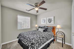 Bedroom featuring carpet flooring and a ceiling fan