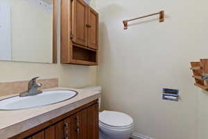 Bathroom with toilet and vanity