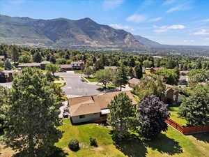 Aerial perspective of suburban area featuring a mountainous background