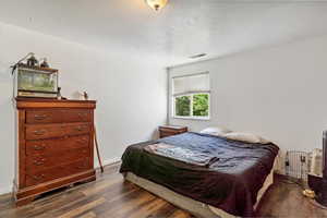 Bedroom featuring wood finished floors