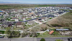 Aerial perspective of suburban area featuring a mountain backdrop
