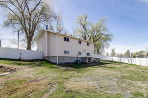 Back of house with a gate