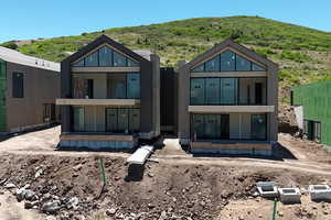Rear view of house with a mountain view