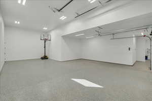 Garage featuring baseboards
