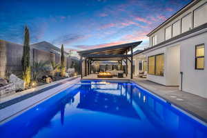 View of swimming pool featuring an outdoor hangout area, a fenced backyard, a gazebo, and a patio area
