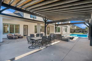 View of patio featuring an outdoor hangout area and outdoor dining area