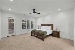 Bedroom with light carpet, access to exterior, recessed lighting, and multiple windows