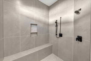 Full bath with tiled shower