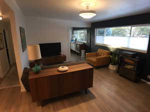 Living room featuring wood finished floors and baseboards