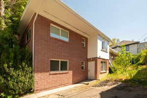 View of home's exterior featuring brick siding