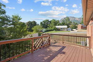 Wooden deck featuring a mountain view