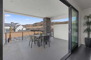 Patio / terrace featuring a mountain view and outdoor dining area