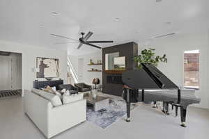 Living room featuring ceiling fan and recessed lighting