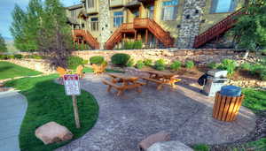 View of patio / terrace with stairs and a grill