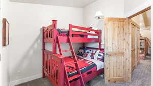 Bedroom with carpet and baseboards