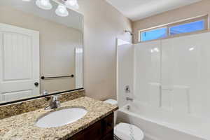 Bathroom featuring vanity and shower / bathtub combination